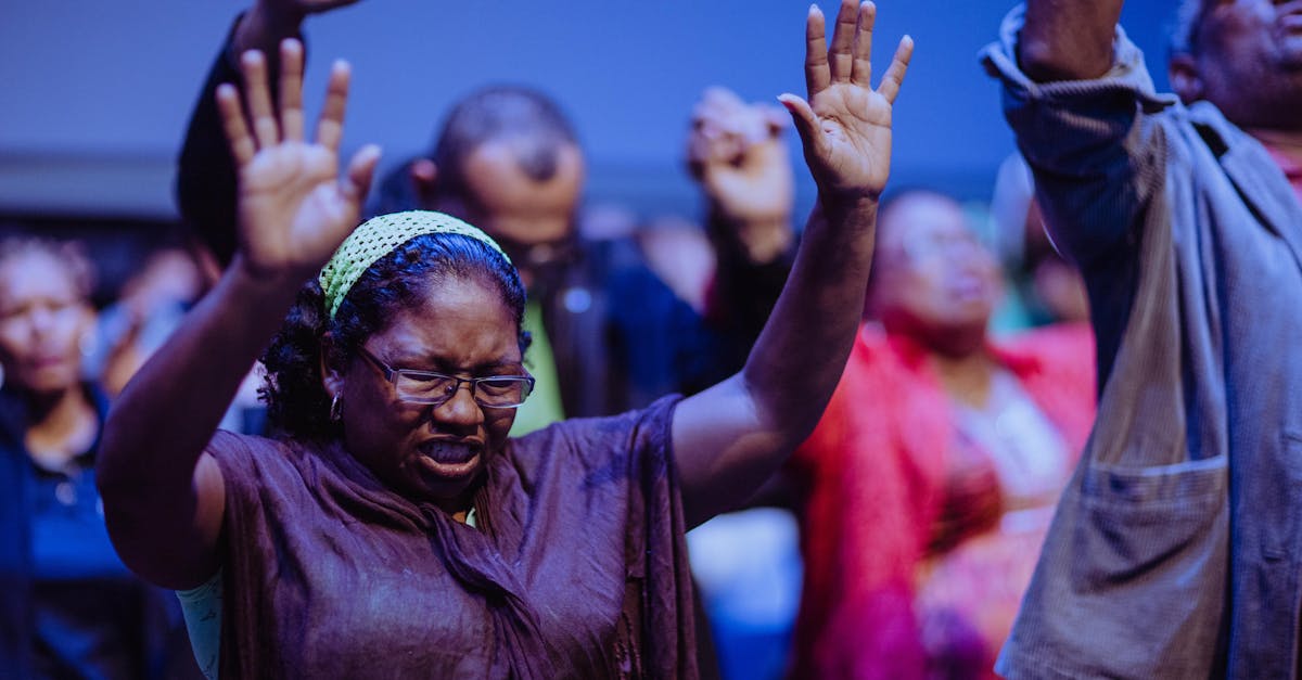 People gathered in a heartfelt prayer meeting, expressing unity and devotion.